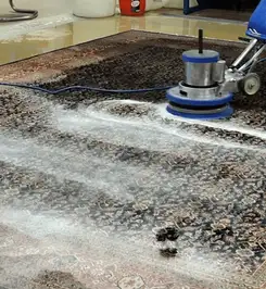 Professional rug cleaning with a rotary floor machine and shampoo foam, deep-cleaning an area rug Henderson, NV.